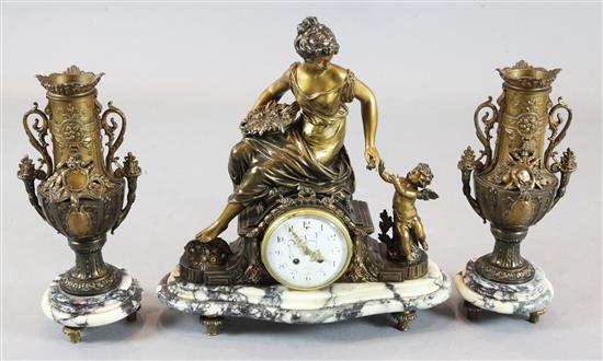 An early 20th century French bronzed spelter three piece clock garniture clock height 20.5in., side ornaments 17in.